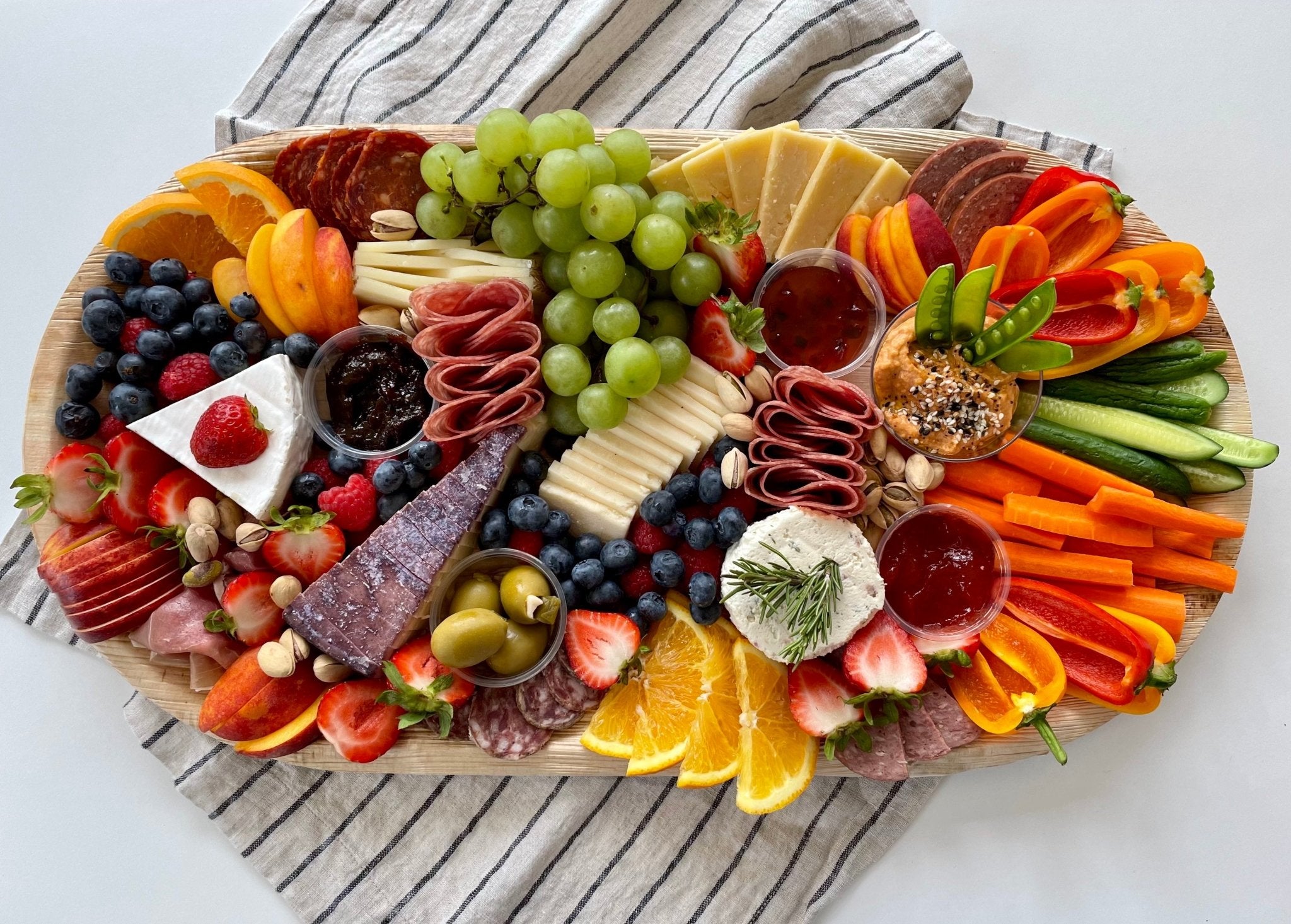 How to put together a charcuterie board: arranged aesthetically for a pleasing charcuterie board assembly