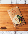 A 3-pack of Bee's Wrap food storage wrap on a Platterful Charcuterie board. 