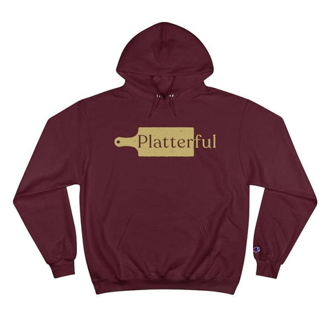 A maroon Champion hoodie with a gold Platterful logo on the front.