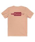 The back of a heather peach colored T-shirt with the Platterful logo in the middle.