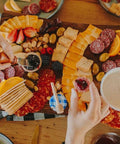 Cheese, meat, crackers, spreadables, olives, nuts and chocolates. Everything you need to create the best charcuterie board that is sure to leave your friends and family drooling!
