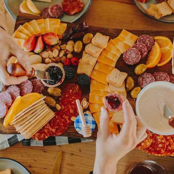 Cheese, meat, crackers, spreadables, olives, nuts and chocolates. Everything you need to create the best charcuterie board that is sure to leave your friends and family drooling!