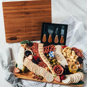 Cheese, meat, crackers, spreadables, olives, nuts, chocolates, knives, and a handcrafted wooden board Everything you need to create the best charcuterie board