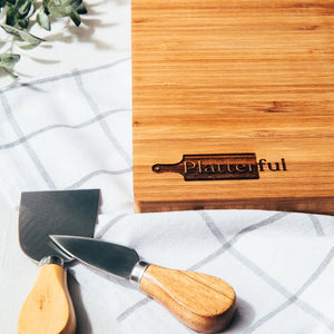 Handcrafted Wooden Bamboo Charcuterie Board with Platterful logo on the bottom left corner